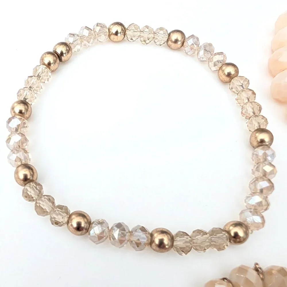 Bundle of nude and natural beaded stretch bracelets